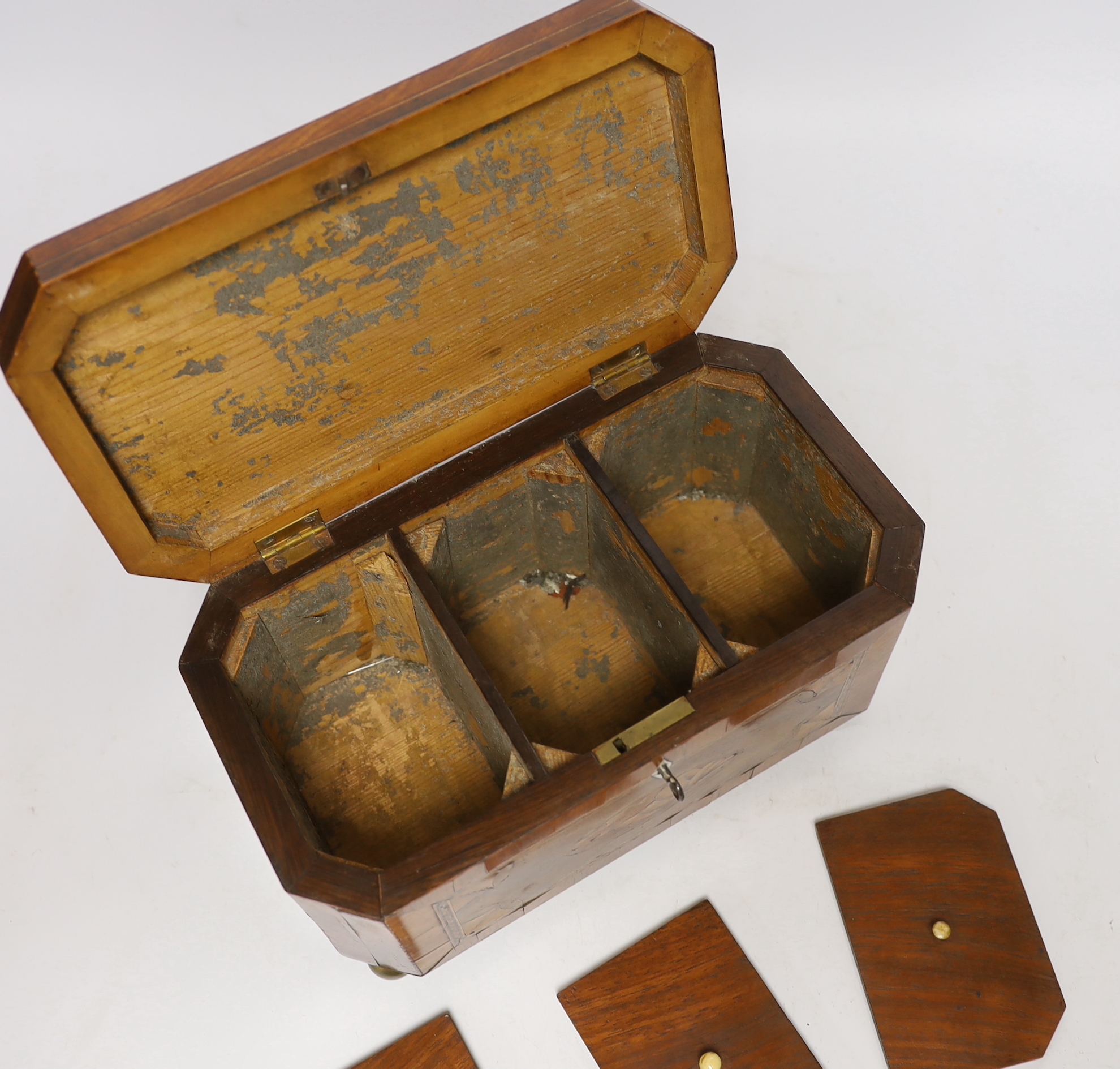 An early 19th century shell inlaid cross banded mahogany tea caddy, 26cm wide